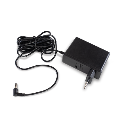 The Ameda Pearl AC power adapter with its coiled lead and right-angle connector, shown with a two round-pin plug fitted