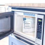 Ameda CleanEase bag standing on the turntable inside a microwave